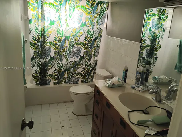 a kitchen with a sink appliances and cabinets