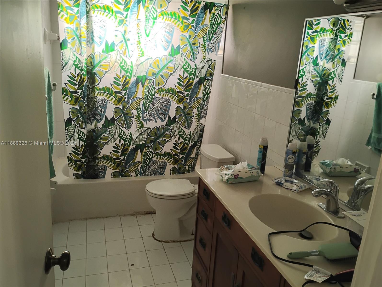 19755 Southwest 190th Street Miami, FL 33187 - Photo 13 of 17 a bathroom with a granite countertop sink and mirror