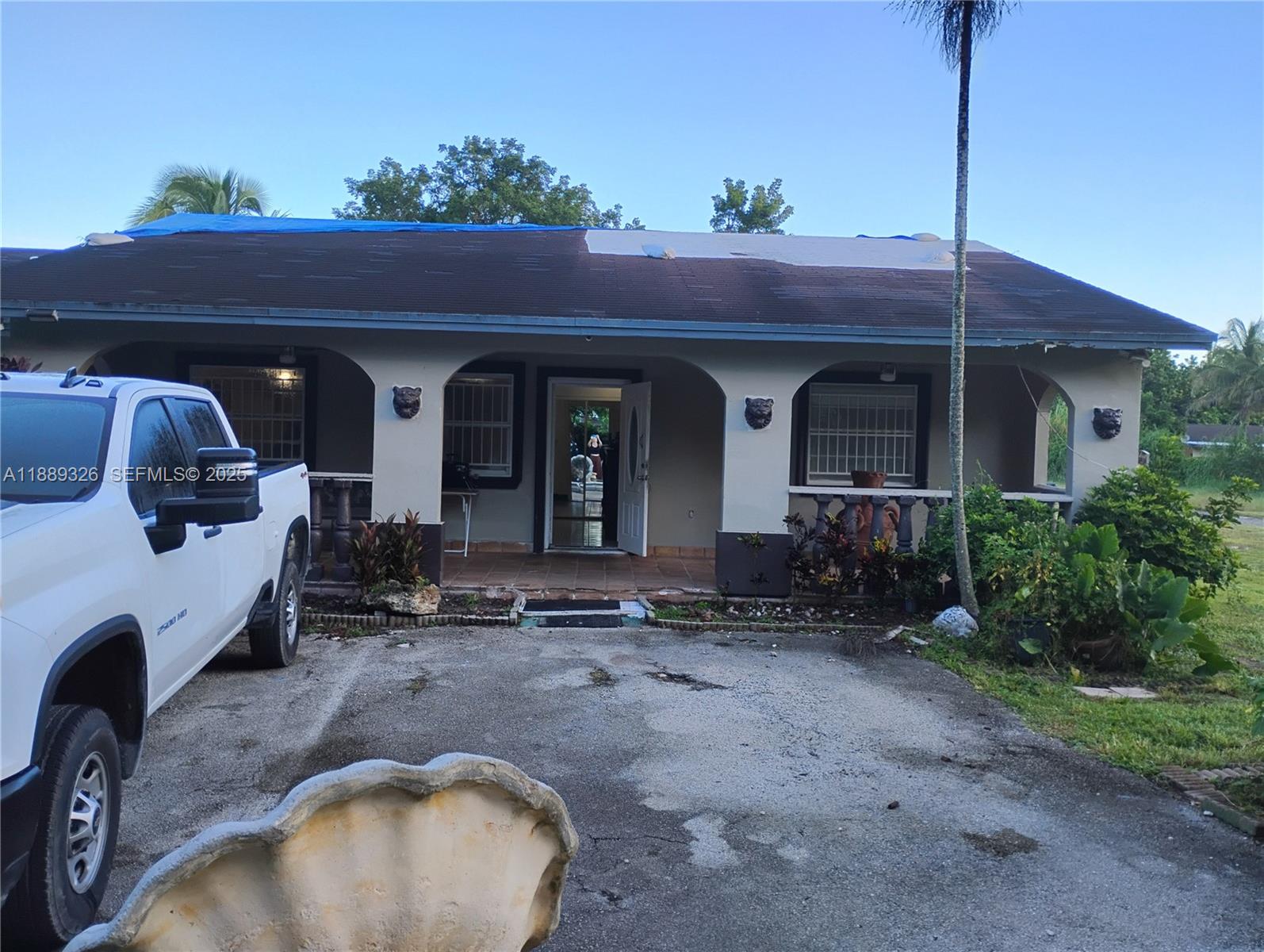 19755 Southwest 190th Street Miami, FL 33187 - Photo 7 of 17 a view of a house with a porch