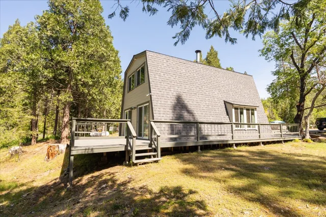 a view of a house with snow on the background
