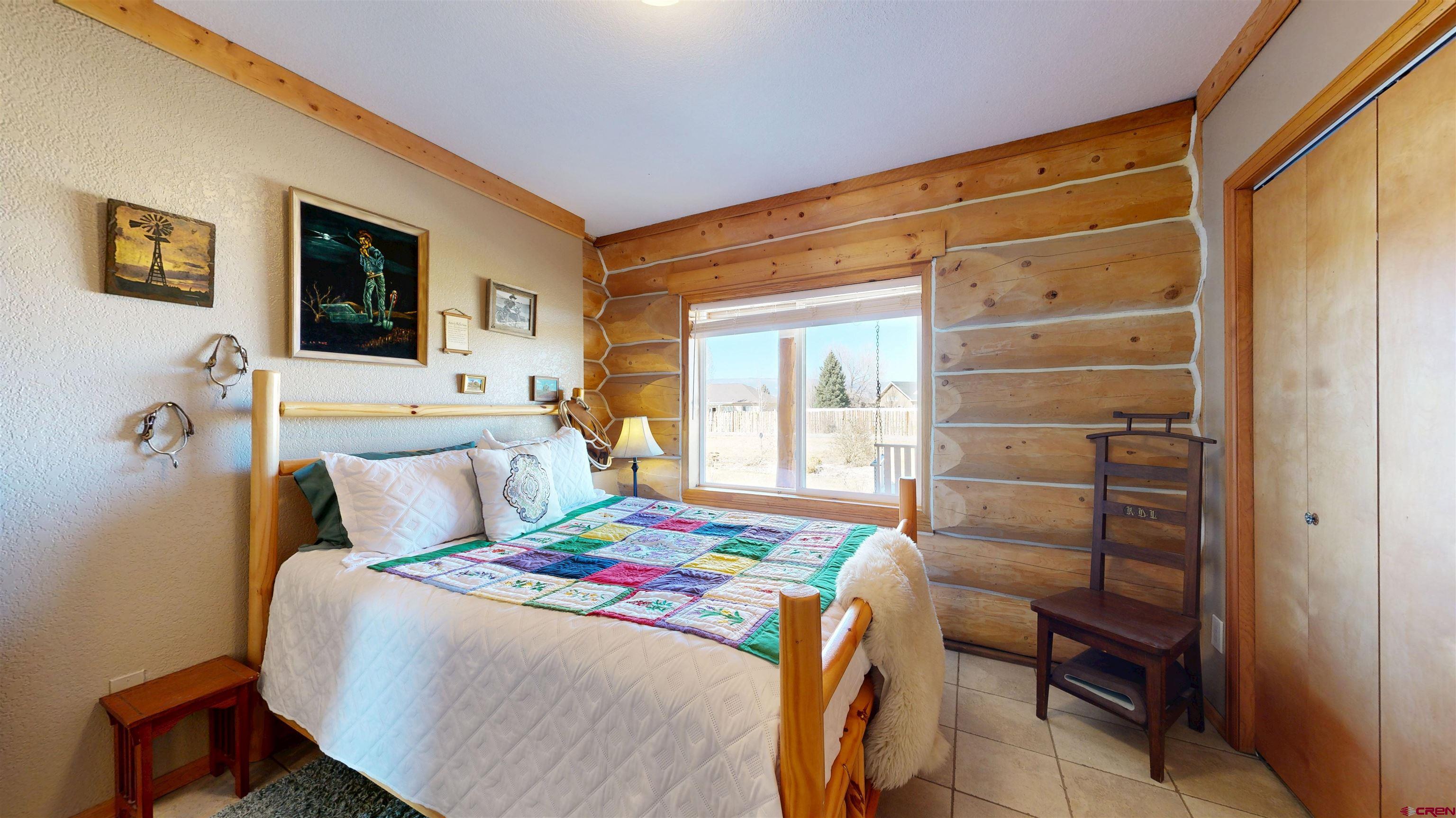 2083 Pioneer Road Delta, CO 81416 - Photo 14 of 45 a bedroom with a bed and a window