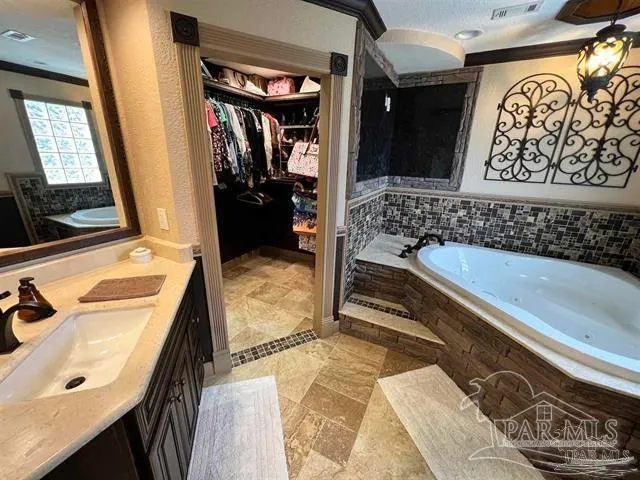 a living room with fireplace furniture and a flat screen tv