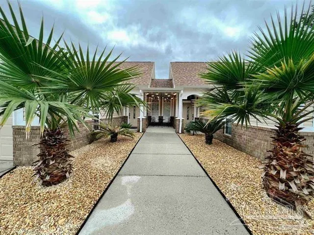 a kitchen with stainless steel appliances granite countertop a refrigerator and a stove