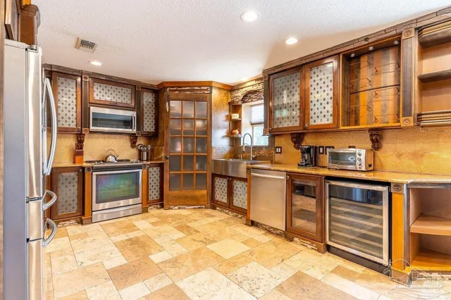 a view of a dining room with furniture and chandelier