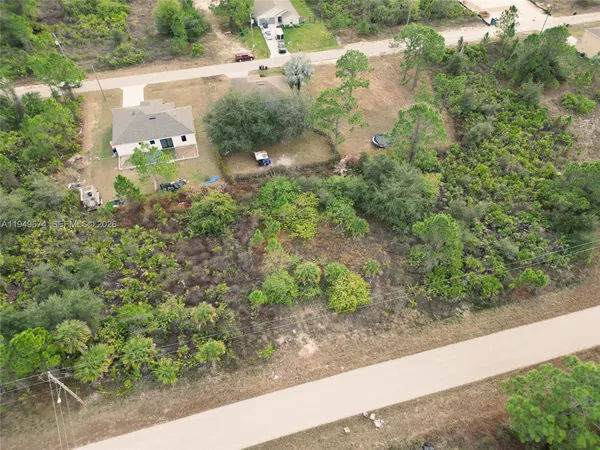 an aerial view of residential house with outdoor space