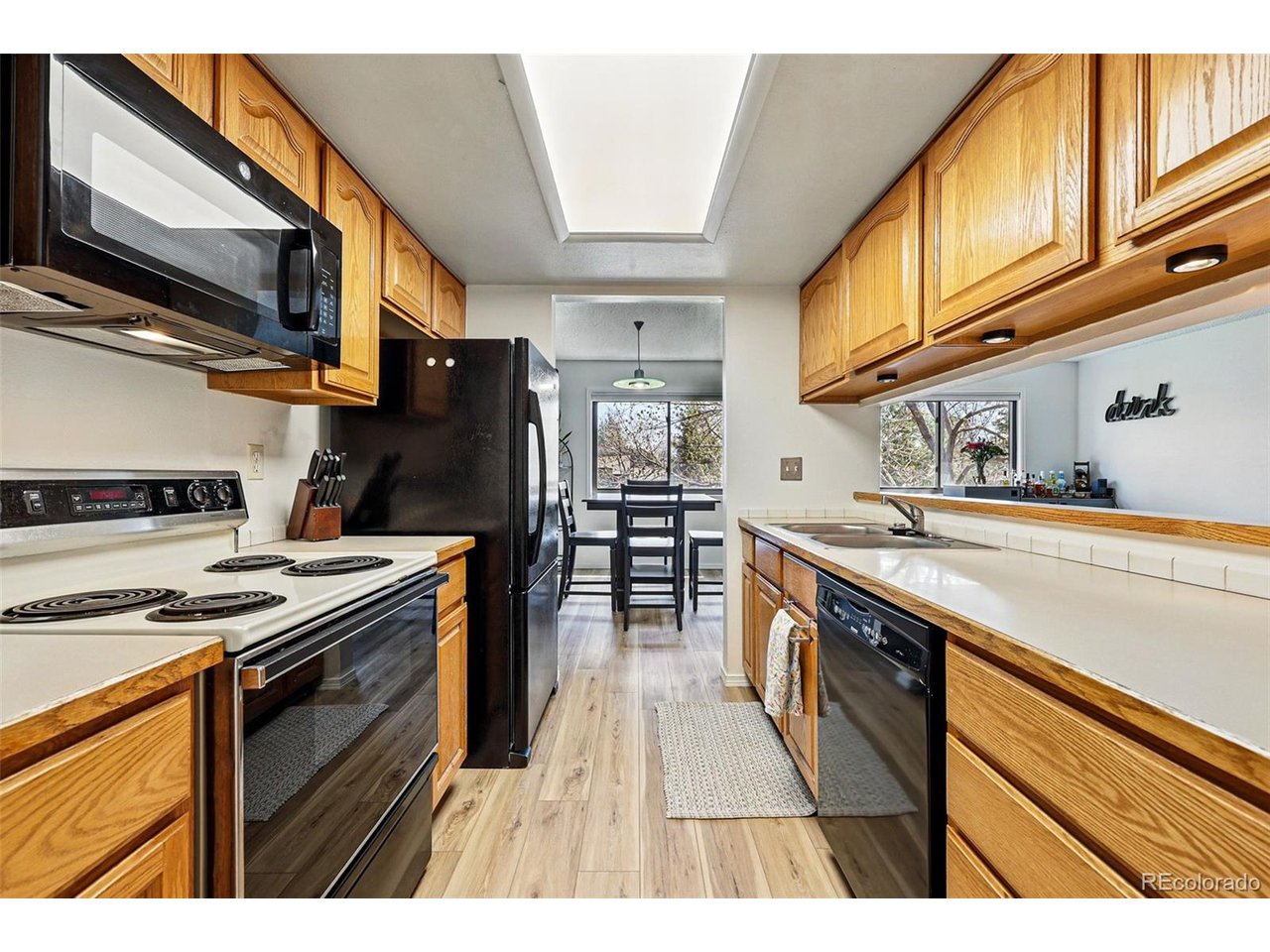 540 South Forest Street, Unit 204 Denver, CO 80246 - Photo 15 of 46 a kitchen with stainless steel appliances granite countertop a stove and a sink