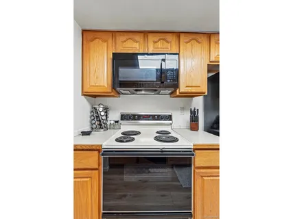 a kitchen with a stove and a microwave