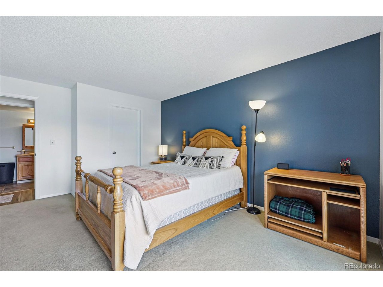 540 South Forest Street, Unit 204 Denver, CO 80246 - Photo 20 of 46 a bedroom with a bed and a dresser