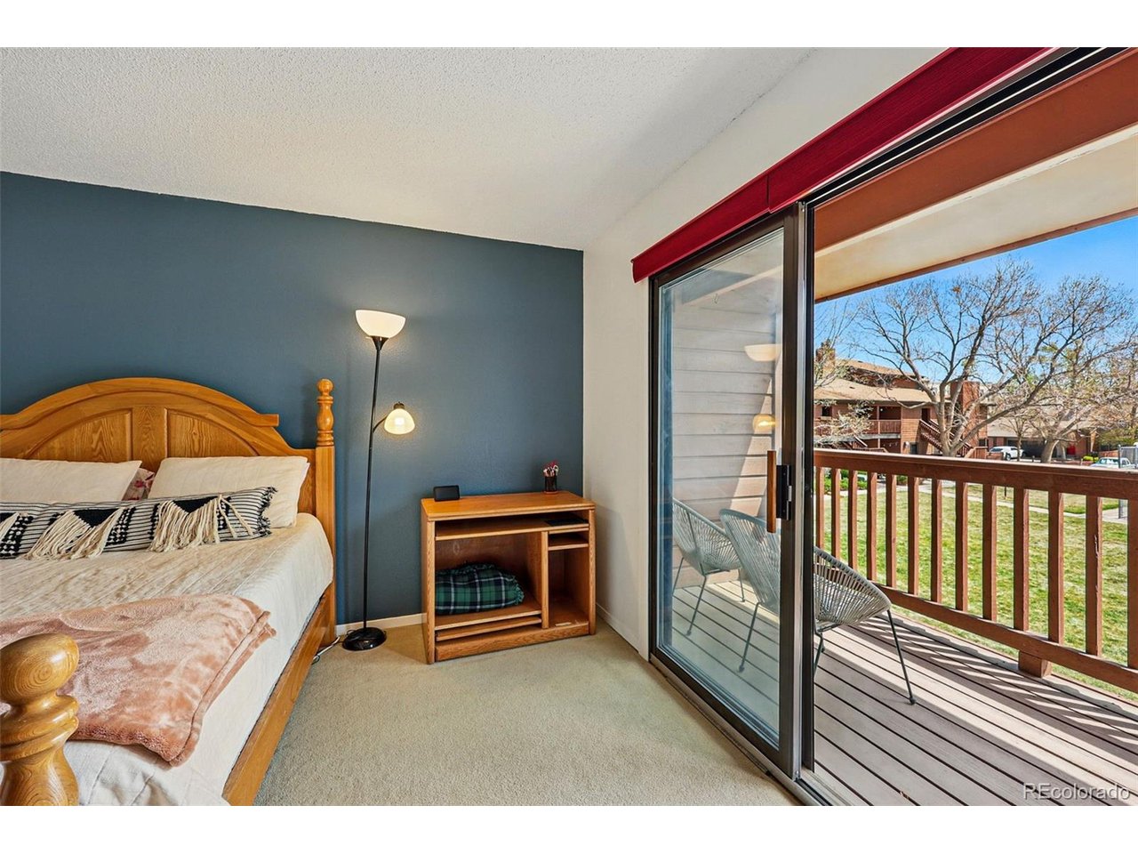 540 South Forest Street, Unit 204 Denver, CO 80246 - Photo 21 of 46 a bedroom with a bed and a view of balcony