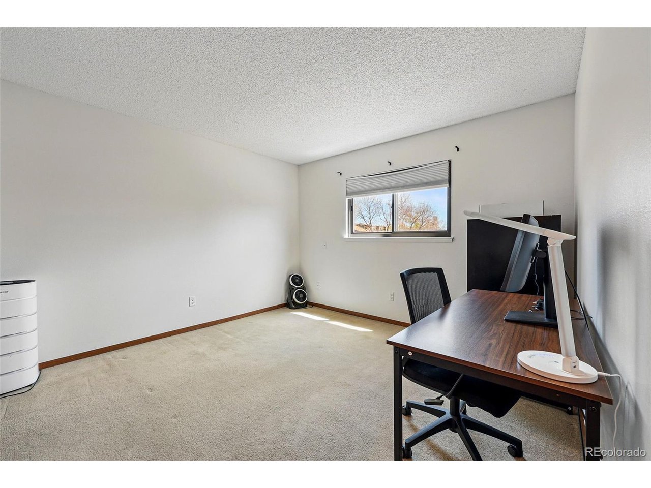 540 South Forest Street, Unit 204 Denver, CO 80246 - Photo 28 of 46 a workspace with furniture and a window
