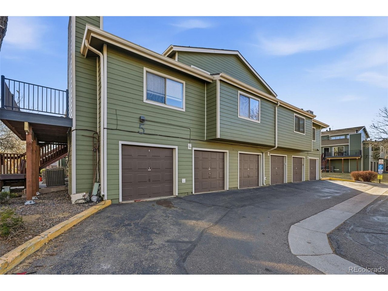 540 South Forest Street, Unit 204 Denver, CO 80246 - Photo 35 of 46 a front view of a house with a yard