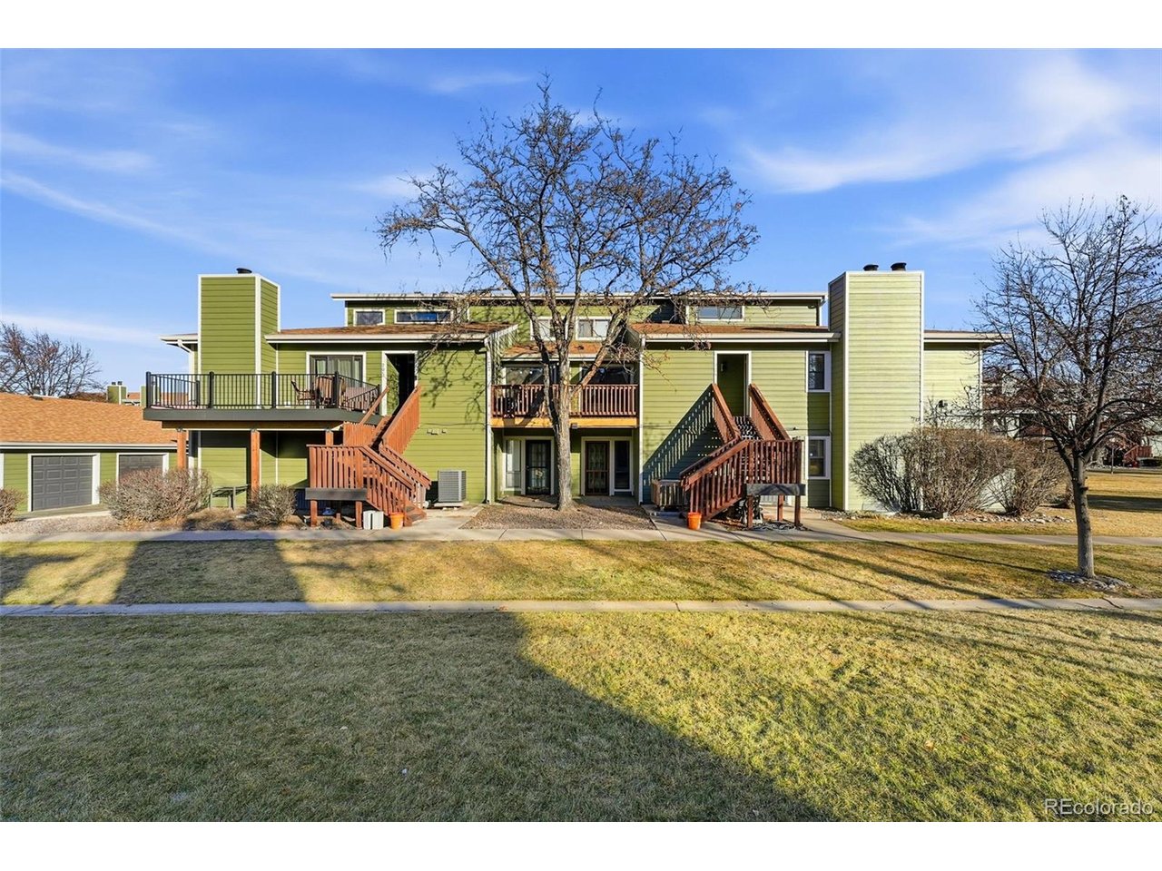 540 South Forest Street, Unit 204 Denver, CO 80246 - Photo 36 of 46 a view of a swimming pool with a yard and a large tree