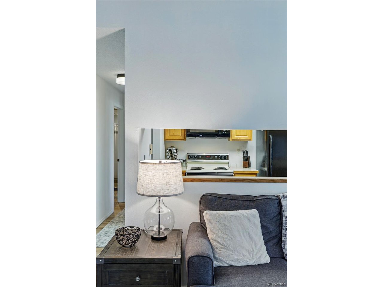 540 South Forest Street, Unit 204 Denver, CO 80246 - Photo 4 of 46 a living room with furniture and a table