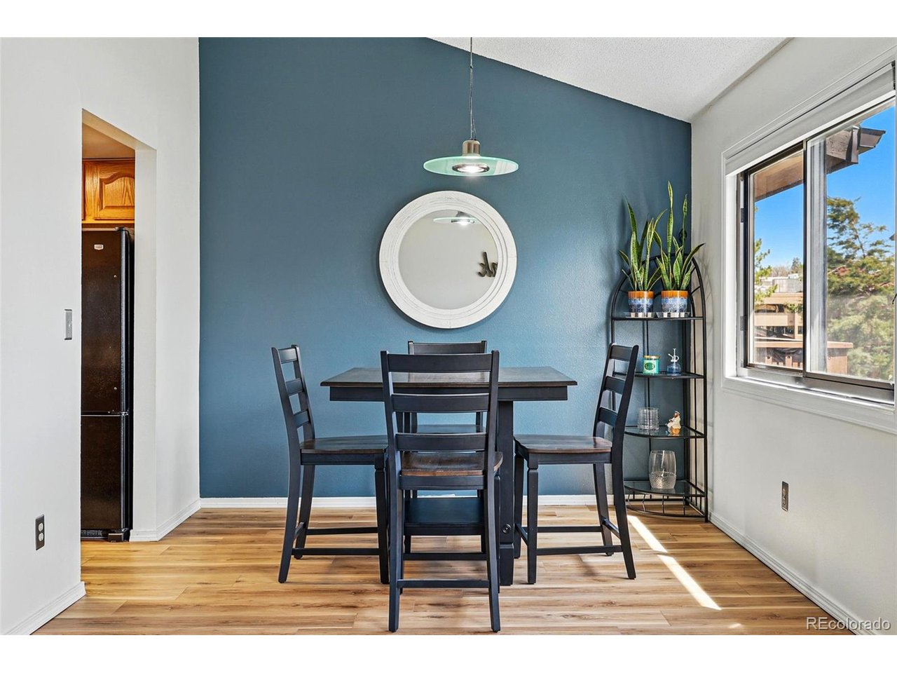 540 South Forest Street, Unit 204 Denver, CO 80246 - Photo 8 of 46 a dining room with furniture and wooden floor
