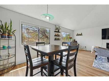 a dining room with furniture and window