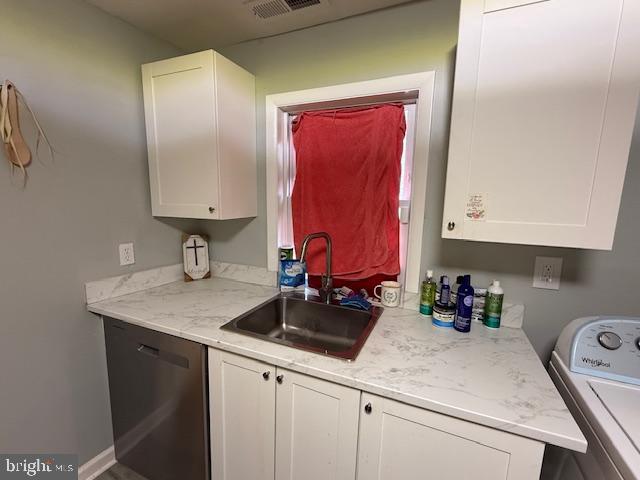 800 Wood Street Cambridge, MD 21613 - Photo 4 of 10 a kitchen with a sink dishwasher and cabinets
