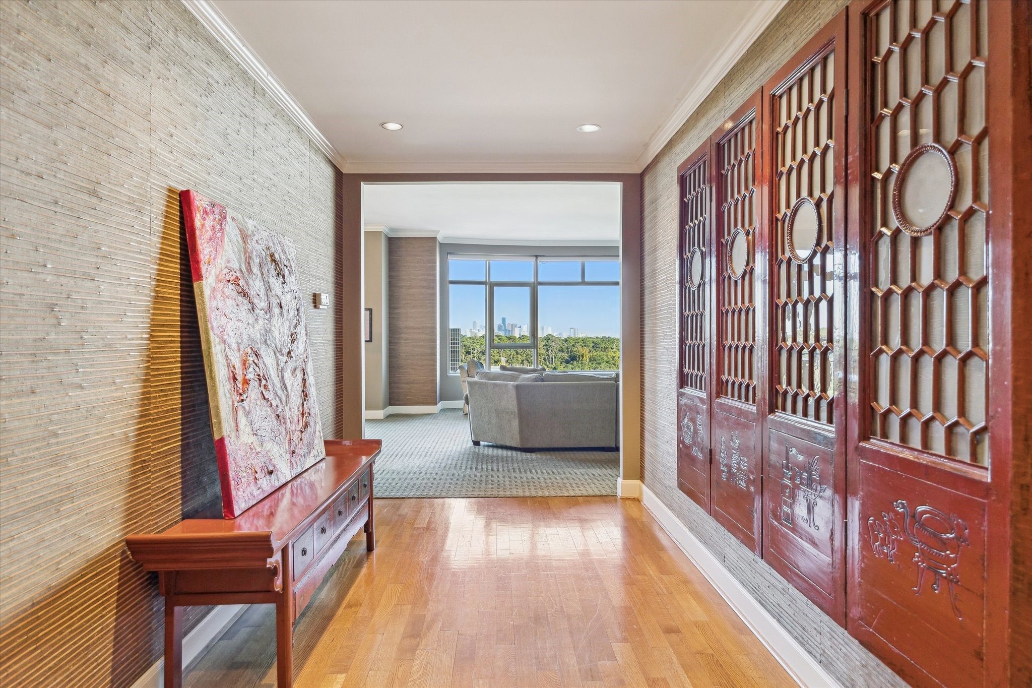 1000 Uptown Park Boulevard, Unit 93 Houston, TX 77056 - Photo 13 of 37 a view of a hallway with wooden floor and windows