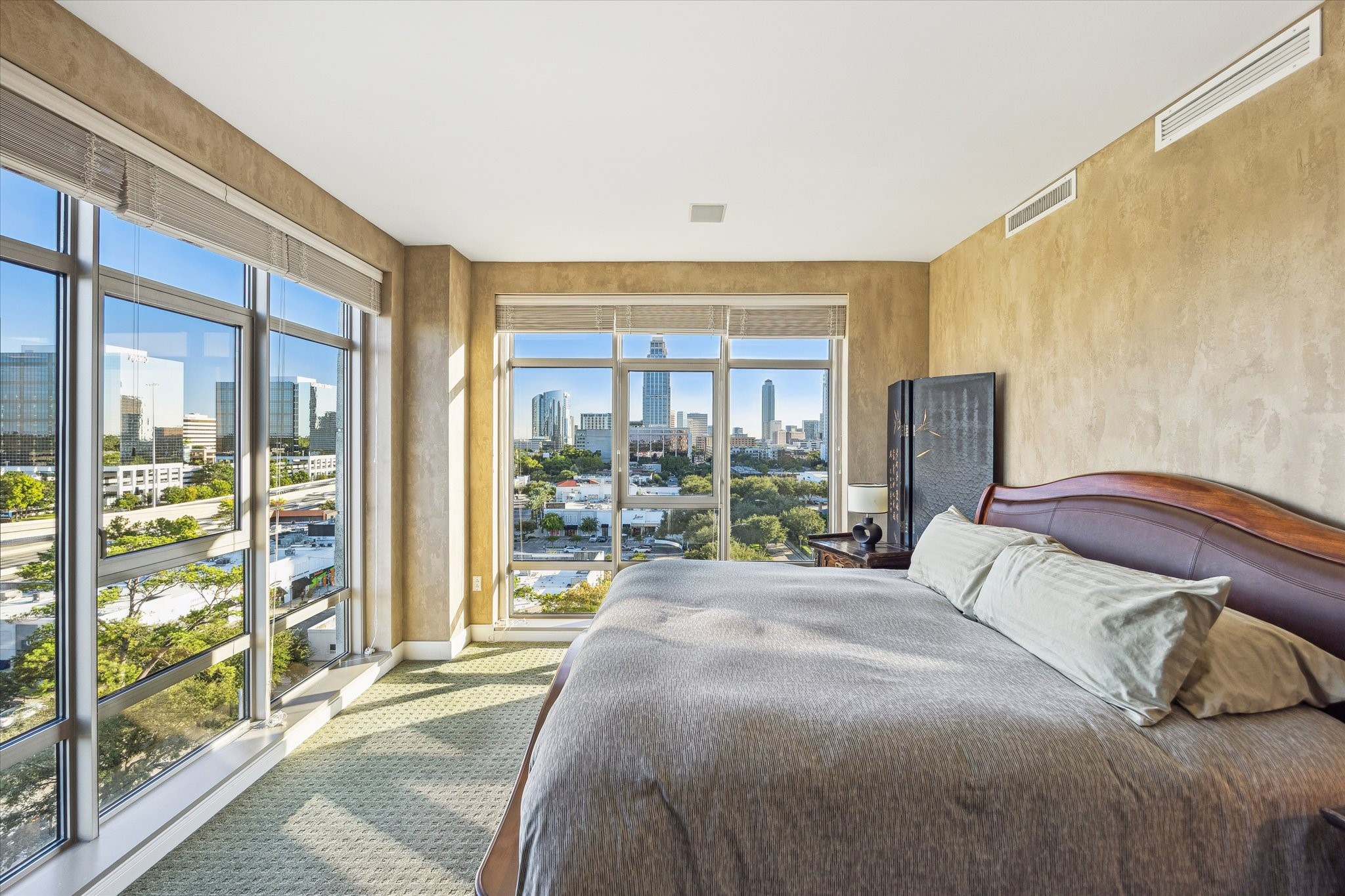 1000 Uptown Park Boulevard, Unit 93 Houston, TX 77056 - Photo 18 of 37 a bedroom with a bed and a large window with outer view