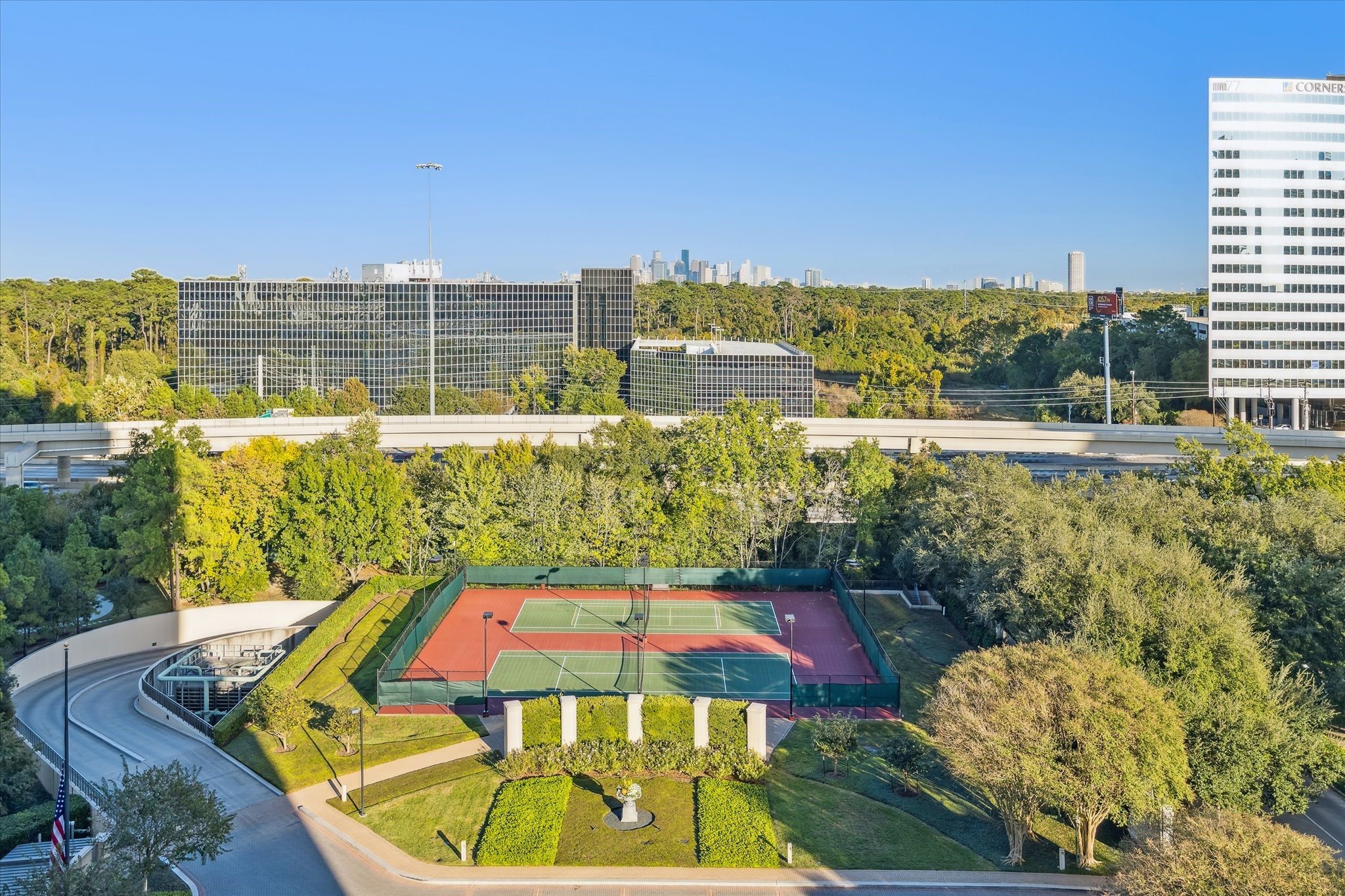 1000 Uptown Park Boulevard, Unit 93 Houston, TX 77056 - Photo 23 of 37 a view of a swimming pool with a lounge chairs