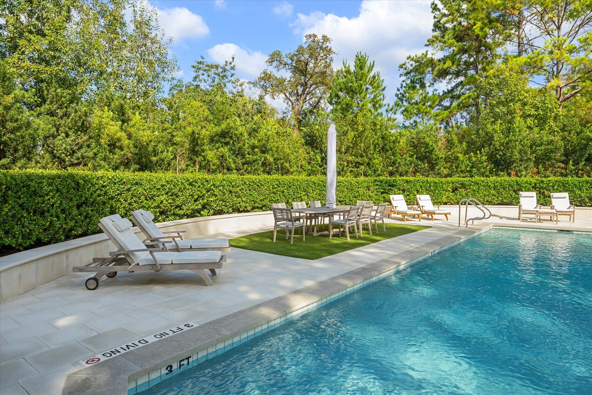 1000 Uptown Park Boulevard, Unit 93 Houston, TX 77056 - Photo 31 of 37 a view of a lake with a bench and trees around