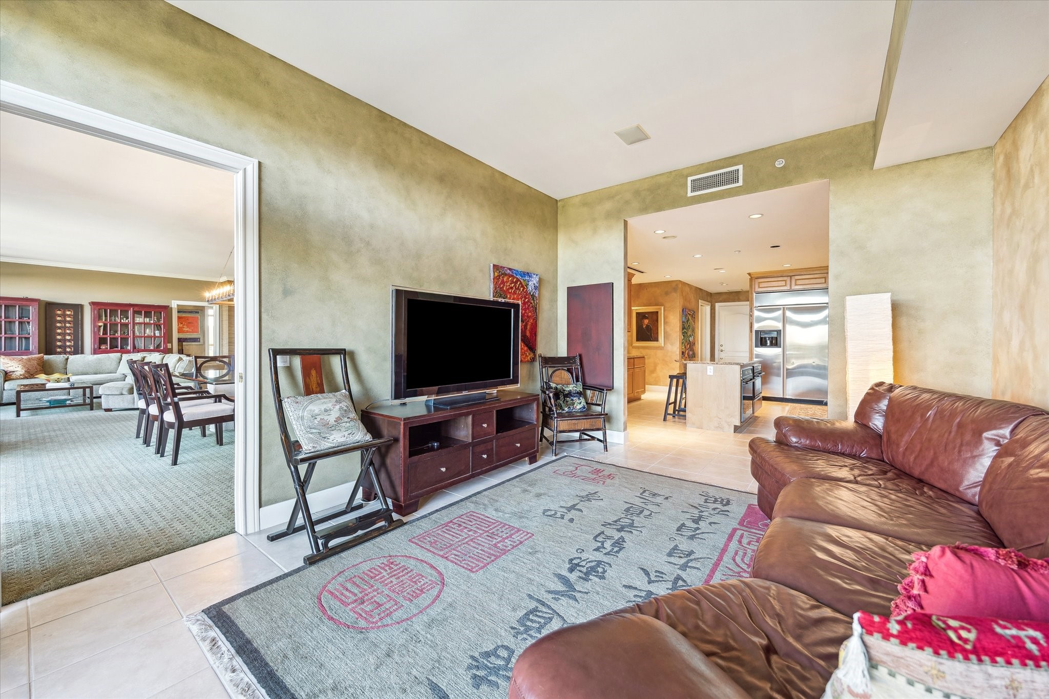 1000 Uptown Park Boulevard, Unit 93 Houston, TX 77056 - Photo 7 of 37 a living room with furniture and a flat screen tv