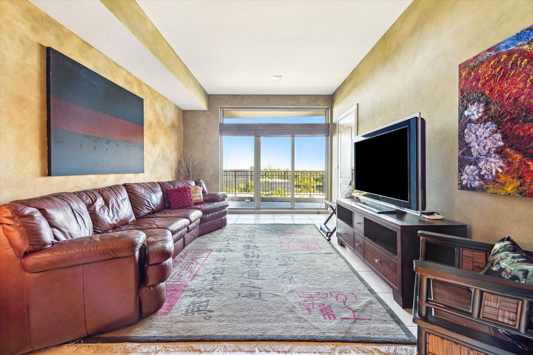 1000 Uptown Park Boulevard, Unit 93 Houston, TX 77056 - Photo 8 of 37 a living room with furniture and a flat screen tv