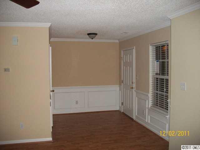 14610 Laura Michelle Road Huntersville, NC 28078 - Photo 3 of 13 an empty room with wooden floor