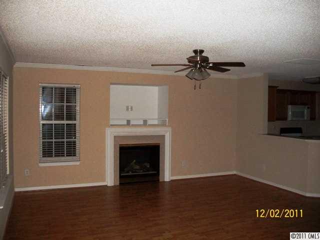 14610 Laura Michelle Road Huntersville, NC 28078 - Photo 4 of 13 a view of a livingroom with a fireplace and window