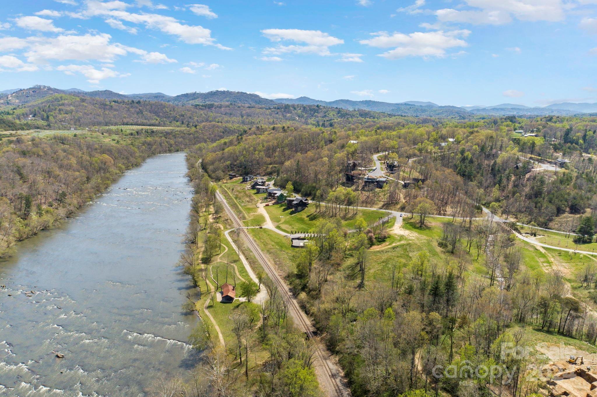 240 Westridge Farm Road, Unit 19 Asheville, NC 28804 - Photo 24 of 31 a view of a lake with a mountain