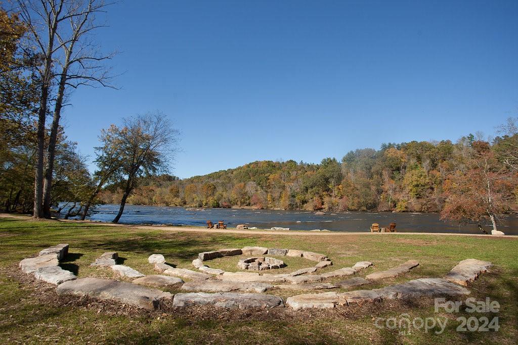 240 Westridge Farm Road, Unit 19 Asheville, NC 28804 - Photo 10 of 31 a view of a lake with a mountain in the background