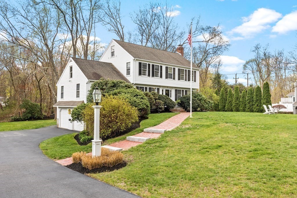 11 Chamberlain Run Hingham, MA 02043 - Photo 2 of 19 a front view of a house with a yard and trees