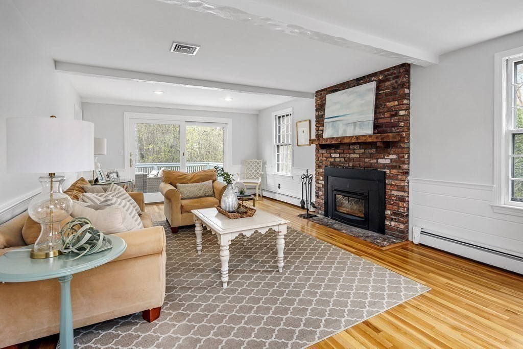 11 Chamberlain Run Hingham, MA 02043 - Photo 6 of 19 a living room with furniture and a fireplace