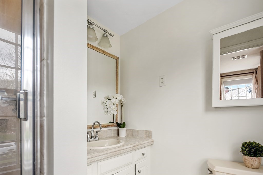 11 Chamberlain Run Hingham, MA 02043 - Photo 10 of 19 a bathroom with a sink and a mirror