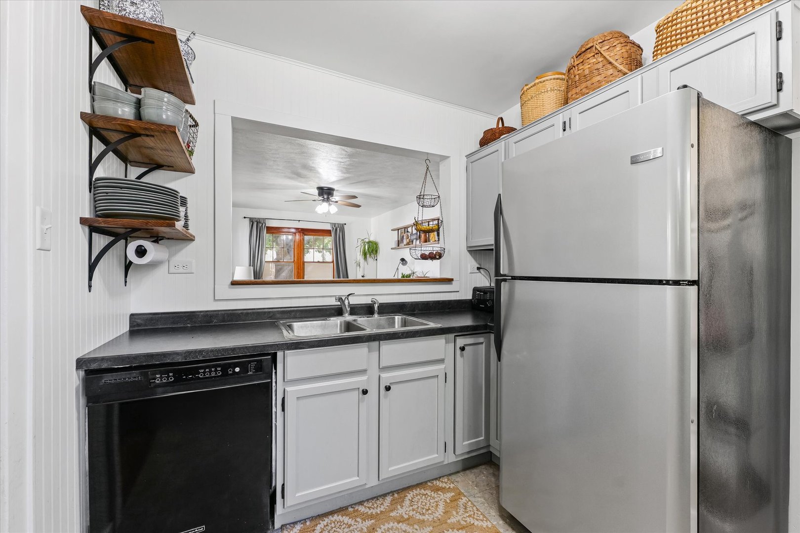 319 West Bond Street Monticello, IL 61856 - Photo 12 of 34 a kitchen with stainless steel appliances granite countertop a refrigerator and a sink