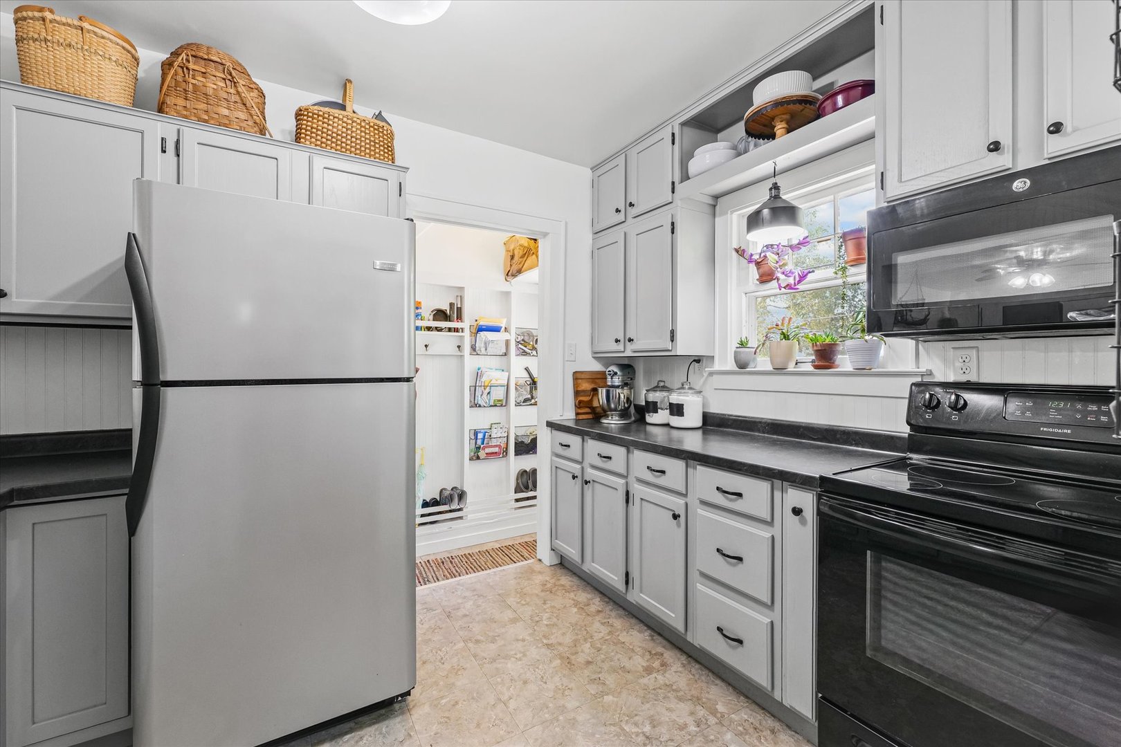 319 West Bond Street Monticello, IL 61856 - Photo 14 of 34 a kitchen with stainless steel appliances a refrigerator sink and white cabinets