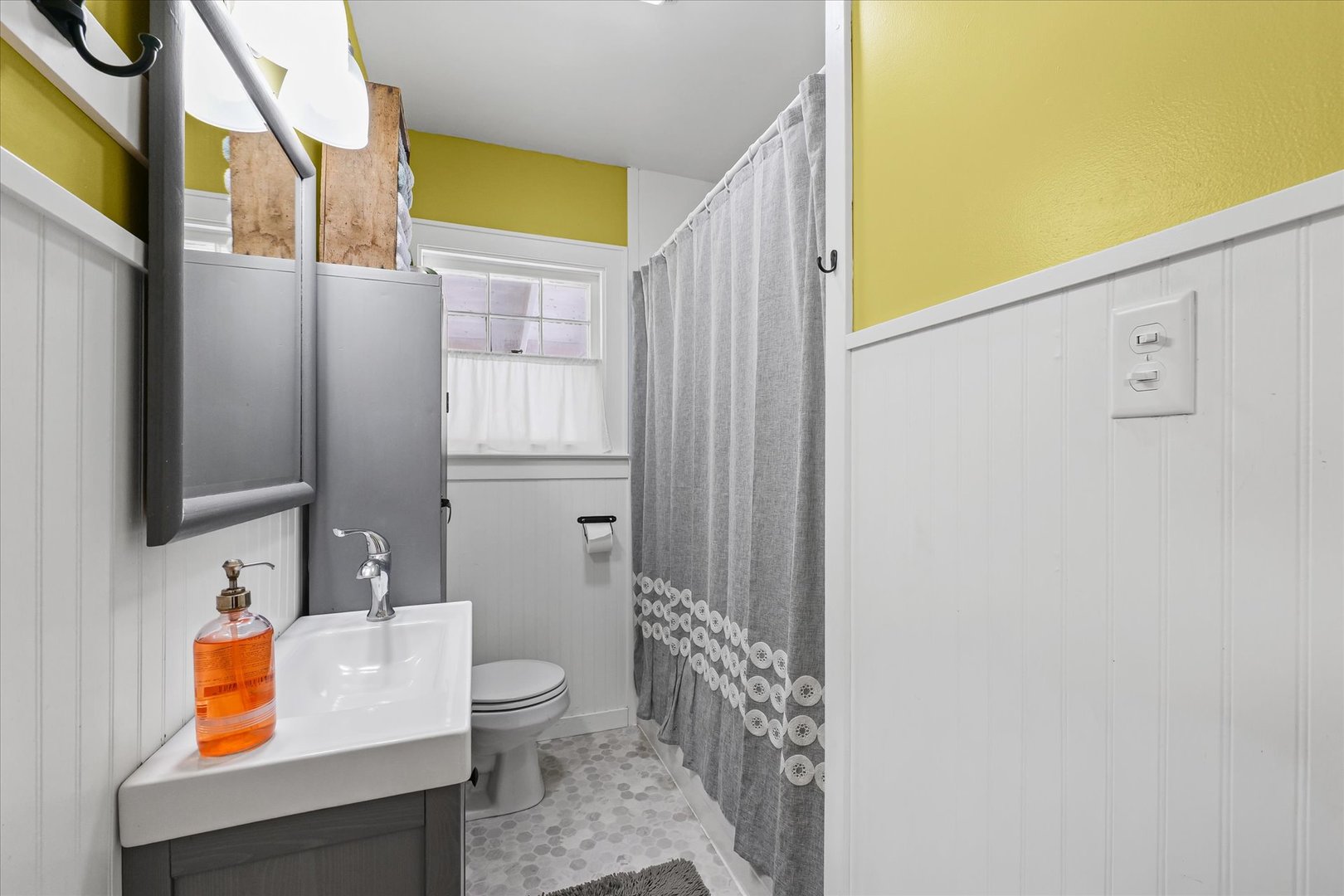 319 West Bond Street Monticello, IL 61856 - Photo 18 of 34 a bathroom with a toilet sink and mirror