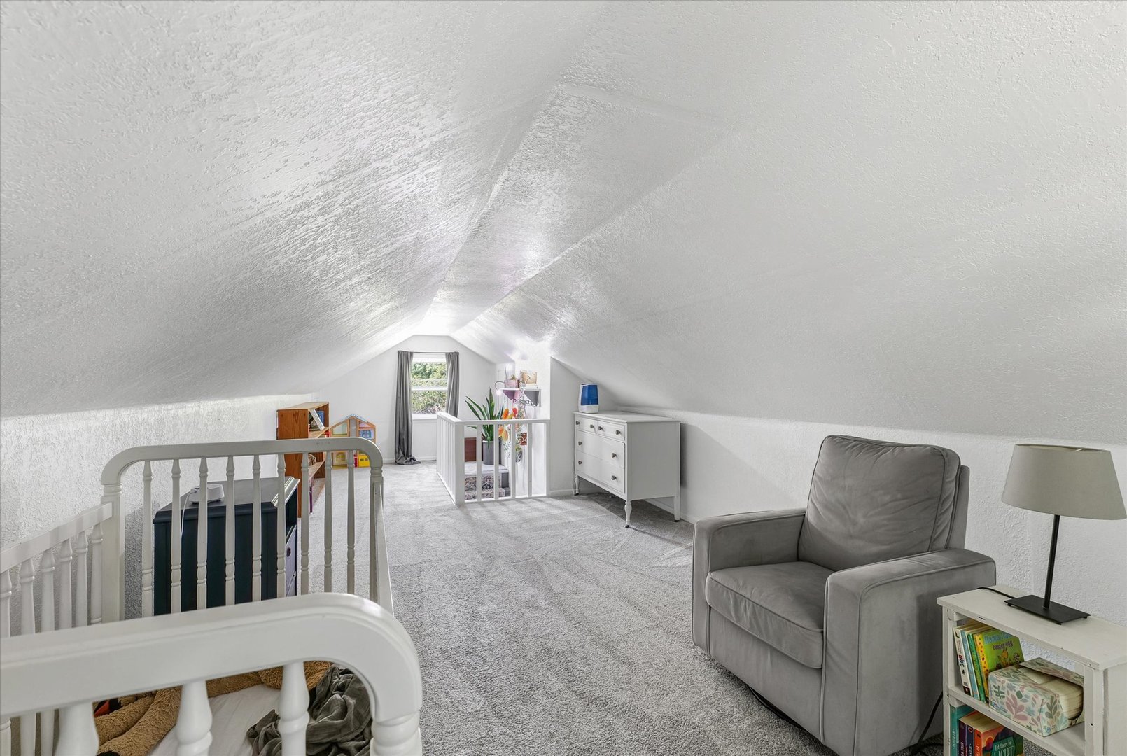 319 West Bond Street Monticello, IL 61856 - Photo 24 of 34 a living room with furniture and a lamp