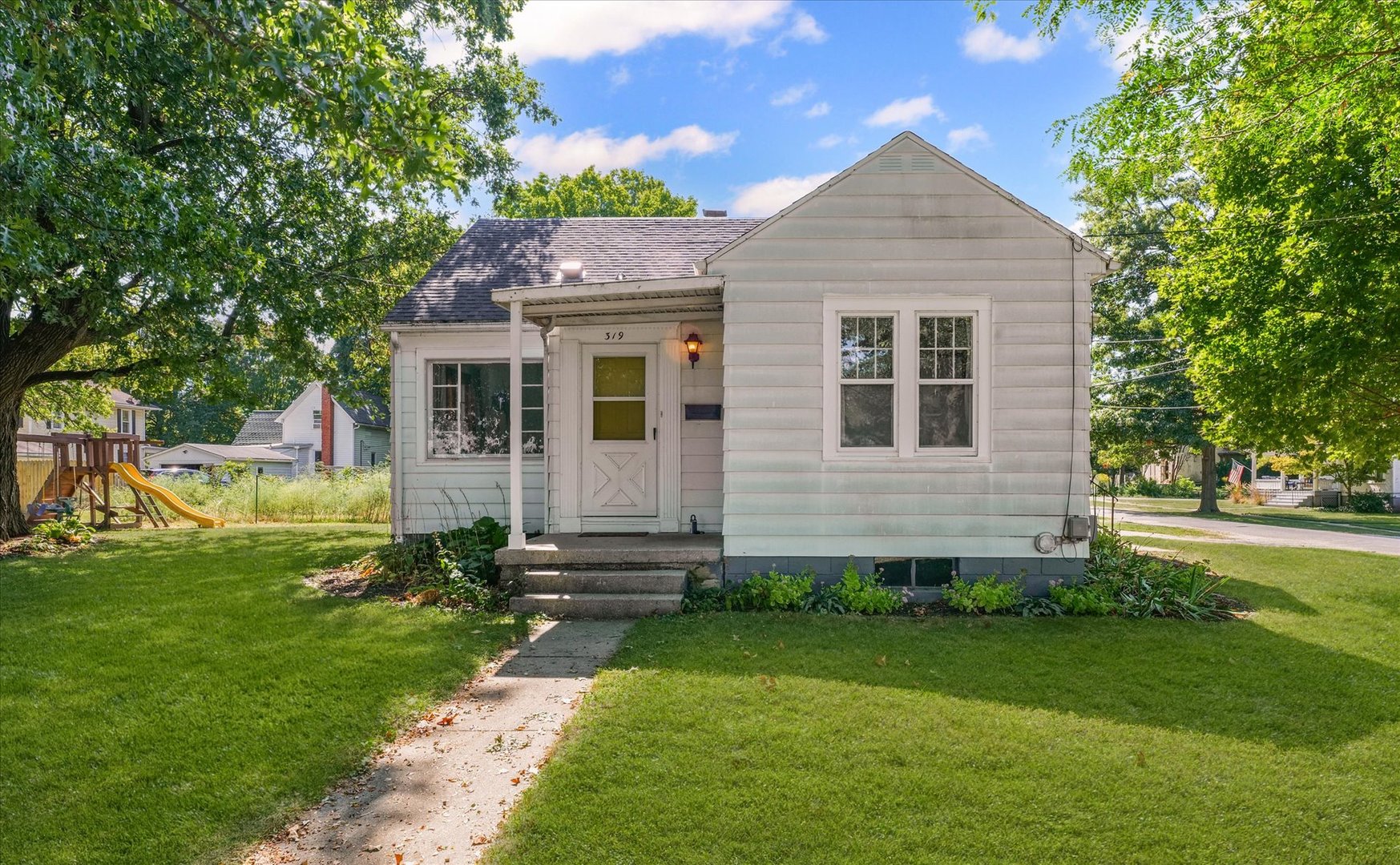 319 West Bond Street Monticello, IL 61856 - Photo 3 of 34 a front view of a house with a yard