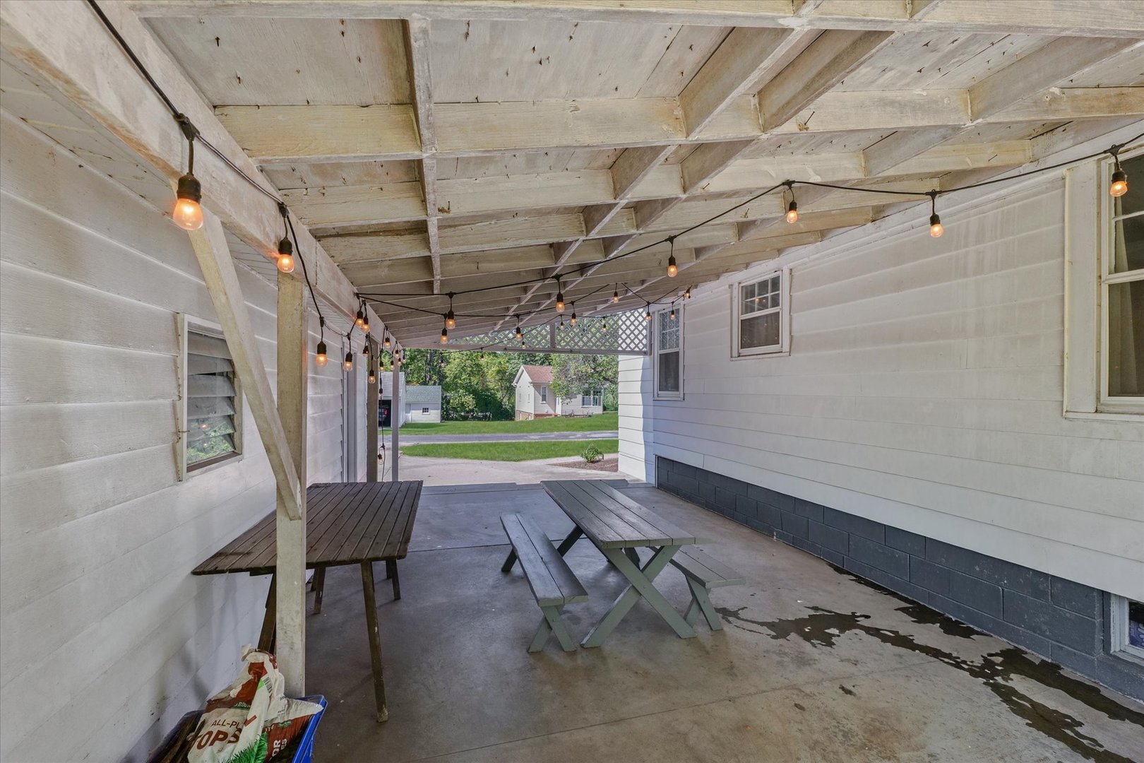 319 West Bond Street Monticello, IL 61856 - Photo 32 of 34 a view of a porch with furniture and a yard