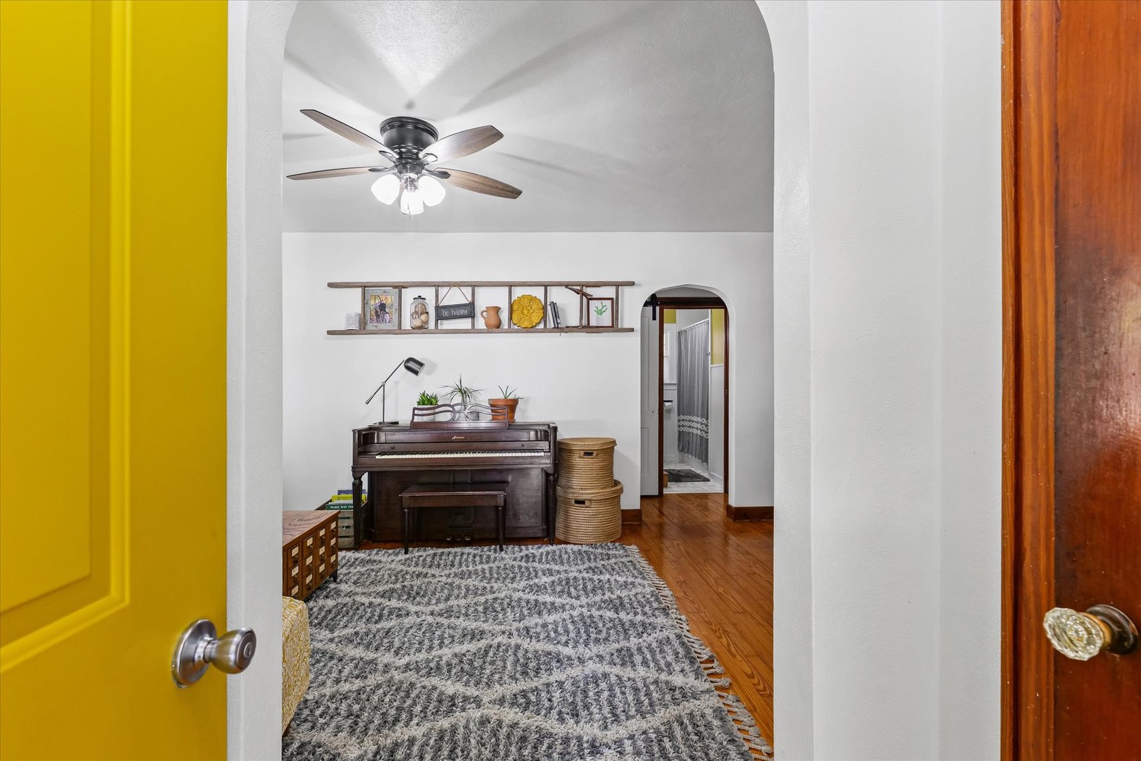 319 West Bond Street Monticello, IL 61856 - Photo 5 of 34 a bedroom with a bed and a chandelier