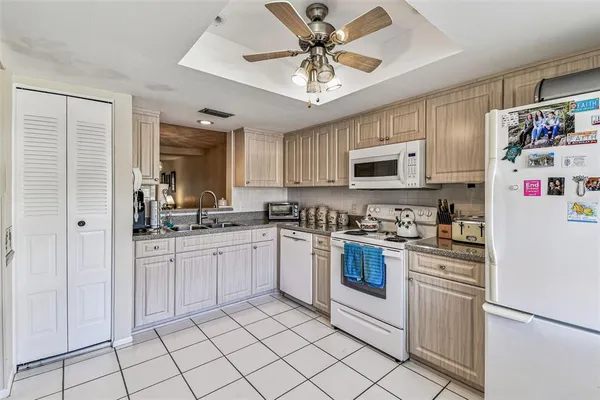 a bathroom with a sink toilet and mirror