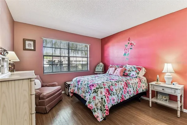 a dining room with furniture and a floor to ceiling window