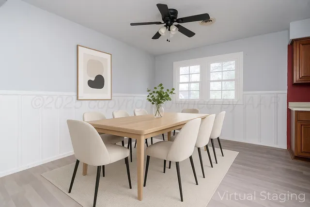 a view of a dining room with furniture and window