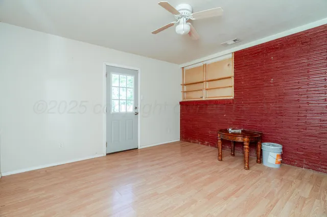 a view of a back yard from a room