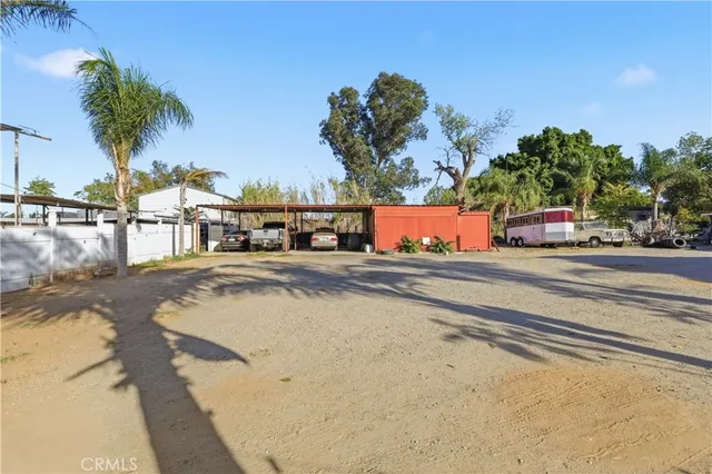 a view of a house with basketball court