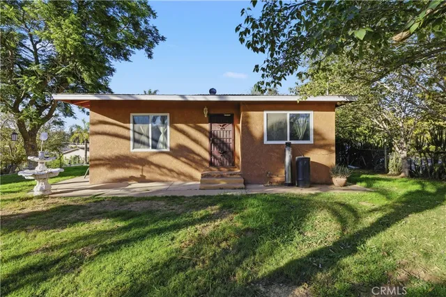 a view of a park with iron fence
