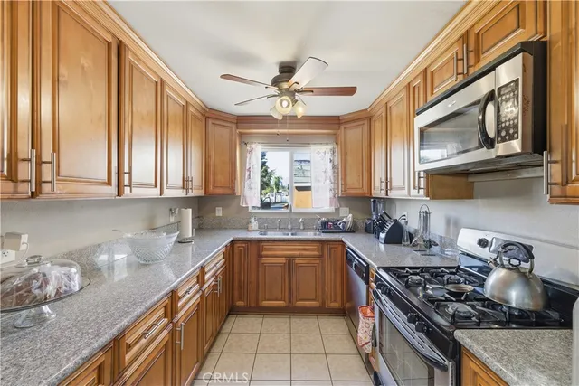 a view of a hallway with workspace and a window