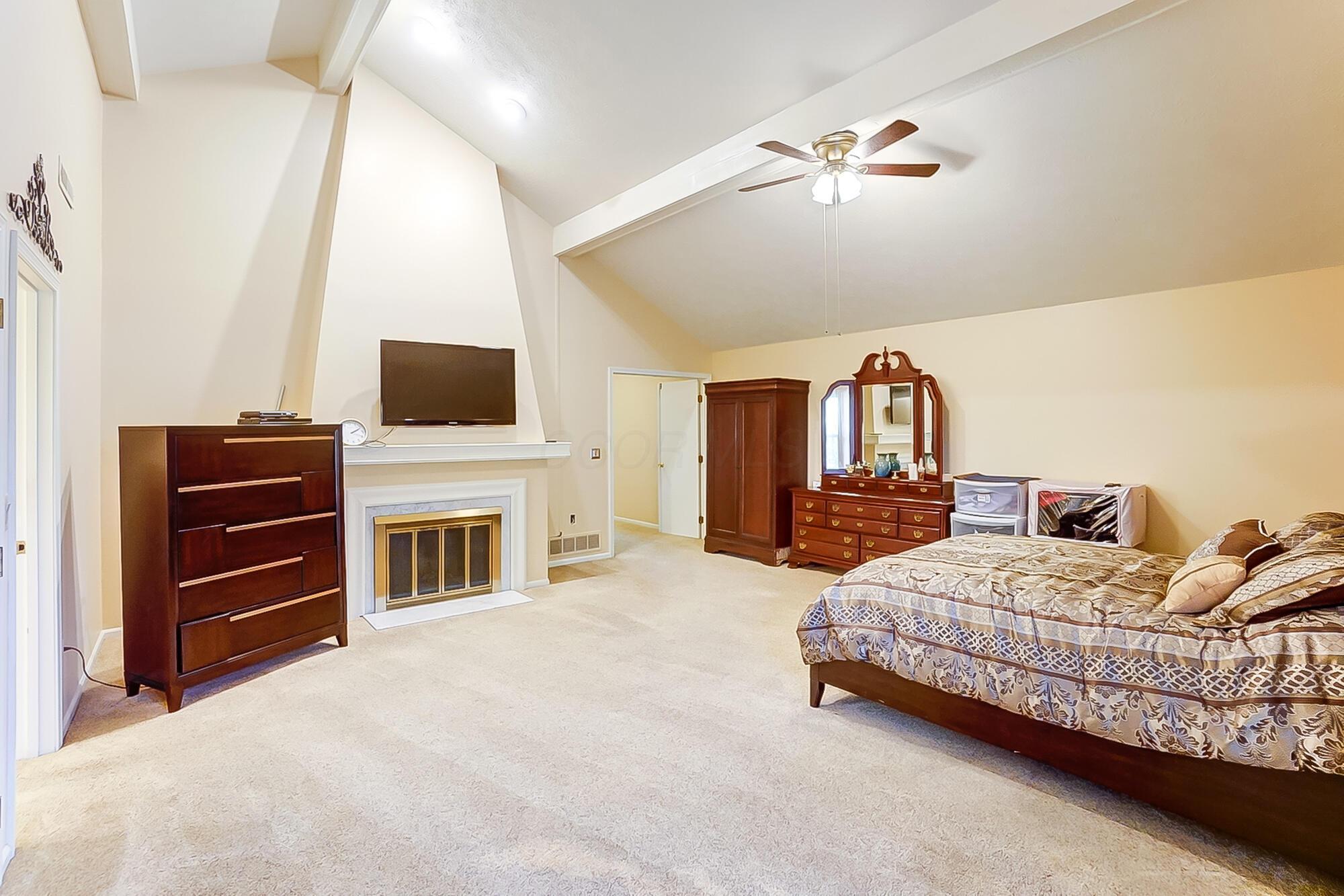 3033 Linmuth Drive West Springfield, OH 45503 - Photo 15 of 22 PRIMARY BEDROOM WITH FIREPLACE VIEW
