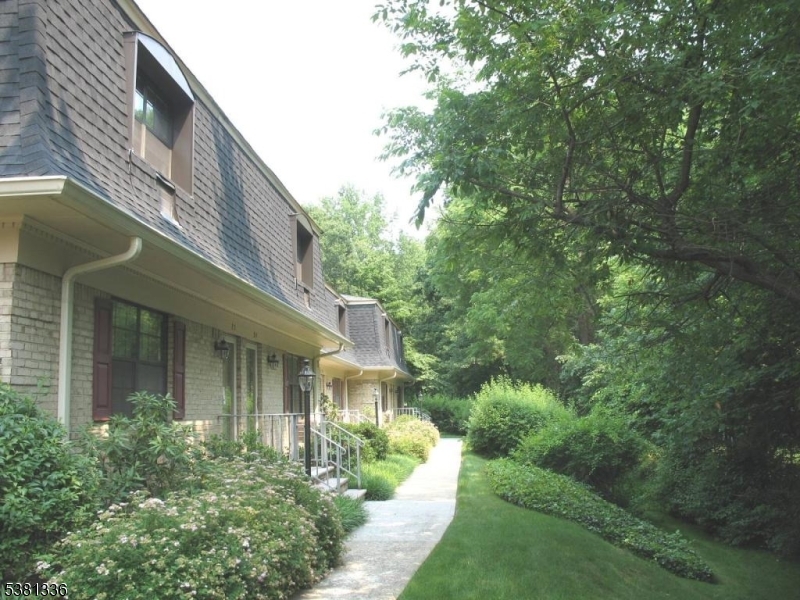 768 Springfield Avenue, Unit E6 Summit, NJ 07901 - Photo 2 of 8 a view of a house with a yard