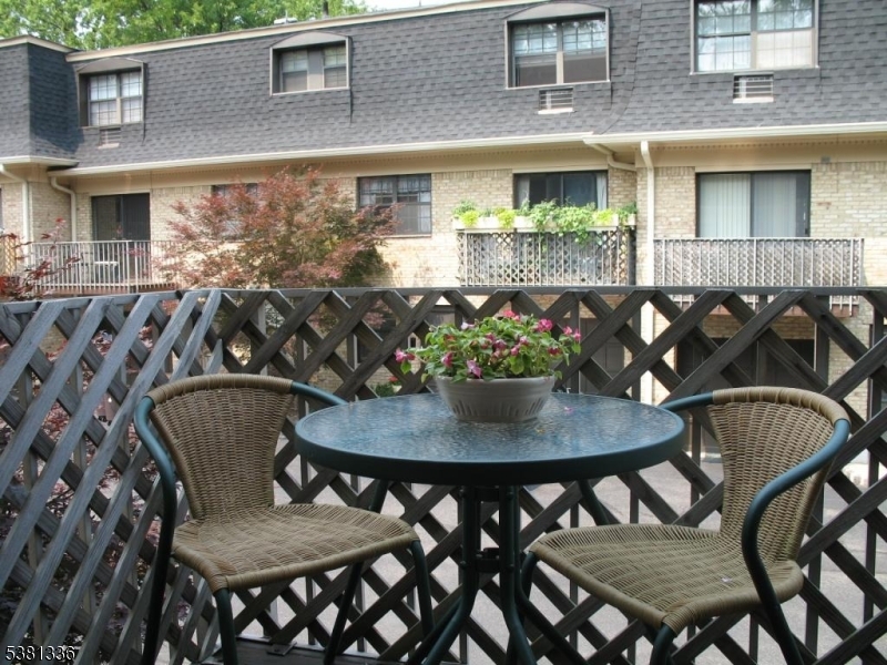 768 Springfield Avenue, Unit E6 Summit, NJ 07901 - Photo 3 of 8 a view of a dining room with furniture and wooden floor